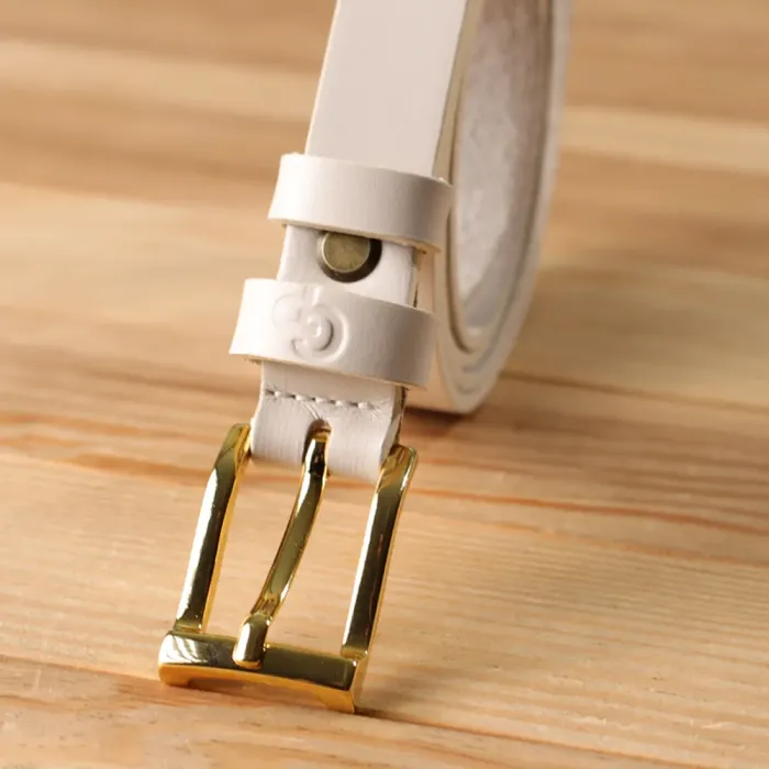 Красивий тонкий шкіряний ремінь для жінок GRANDE PELLE 22949 Молочний