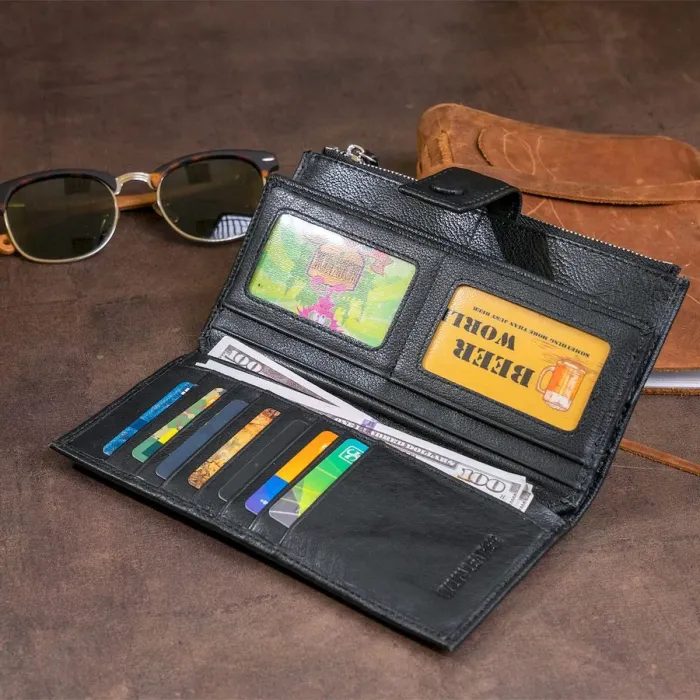 Оригінальний гаманець шкіряний жіночий на хлястиці з кнопкою ST Leather 19280 Чорний