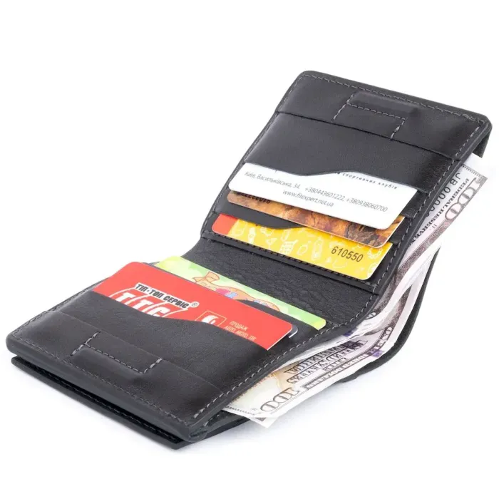 Вертикальне глянсове портмоне з накладною монетницею GRANDE PELLE 11329 Чорне