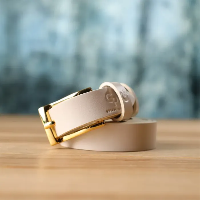 Красивий тонкий шкіряний ремінь для жінок GRANDE PELLE 22949 Молочний