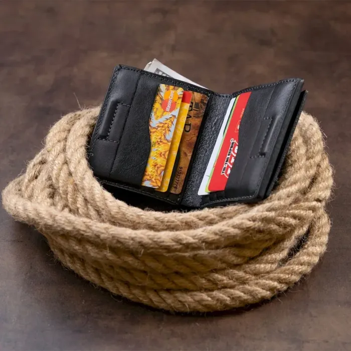 Вертикальне глянсове портмоне з накладною монетницею GRANDE PELLE 11329 Чорне