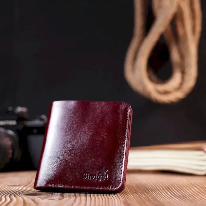 Жіноче глянсове шкіряне портмоне Shvigel 16609 Вишневий