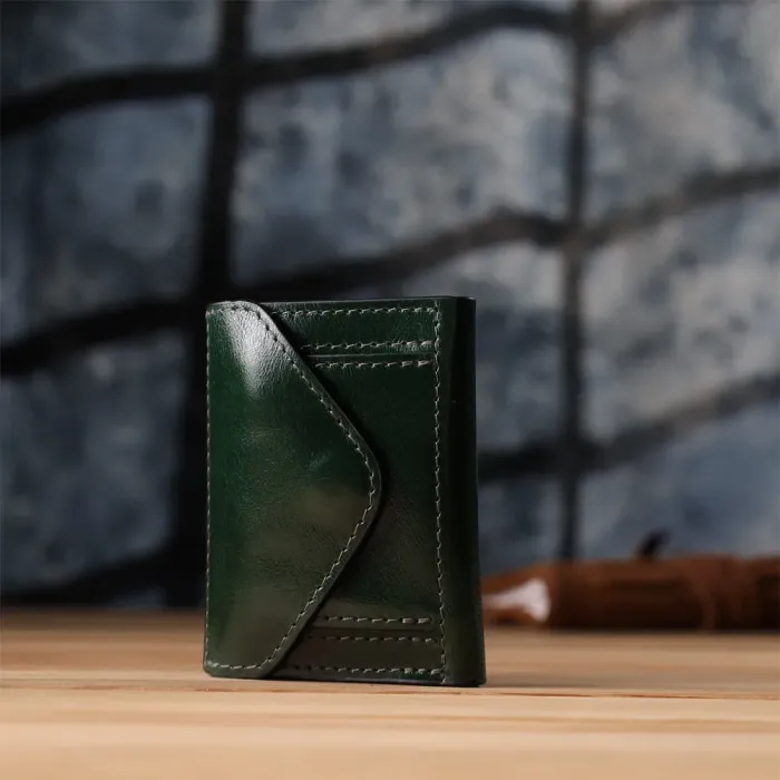 Відмінний гаманець у три складання з натуральної гладкої шкіри GRANDE PELLE 22944 Зелений
