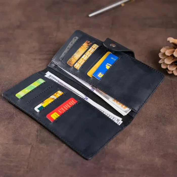 Бумажник мужской вертикальный из винтажной кожи на кнопках SHVIGEL 16182 Черный