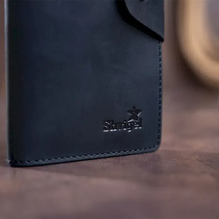 Бумажник мужской вертикальный из винтажной кожи на кнопках SHVIGEL 16182 Черный