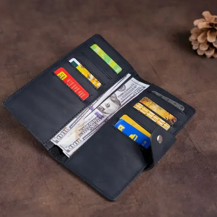 Бумажник мужской вертикальный из винтажной кожи на кнопках SHVIGEL 16182 Черный