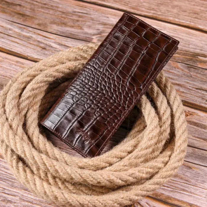 Интересный вертикальный бумажник из натуральной фактурной кожи KARYA 21434 Коричневый