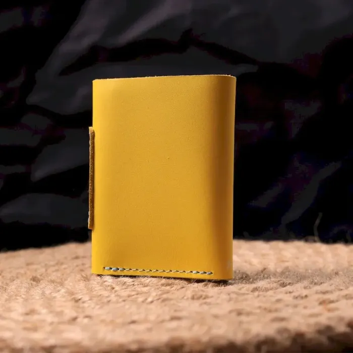 Компактне шкіряне портмоне в три додавання комбі двох кольорів Серце GRANDE PELLE 16730 Жовто-блакитне