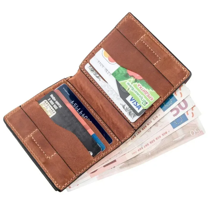 Компактне портмоне унісекс з накладною монетницею GRANDE PELLE 11238 Коричневе