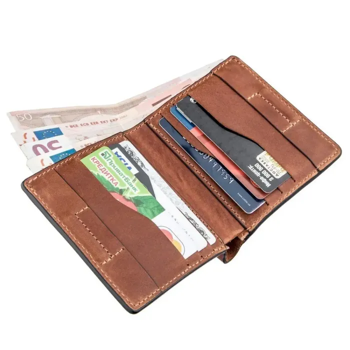 Компактне портмоне унісекс з накладною монетницею GRANDE PELLE 11238 Коричневе