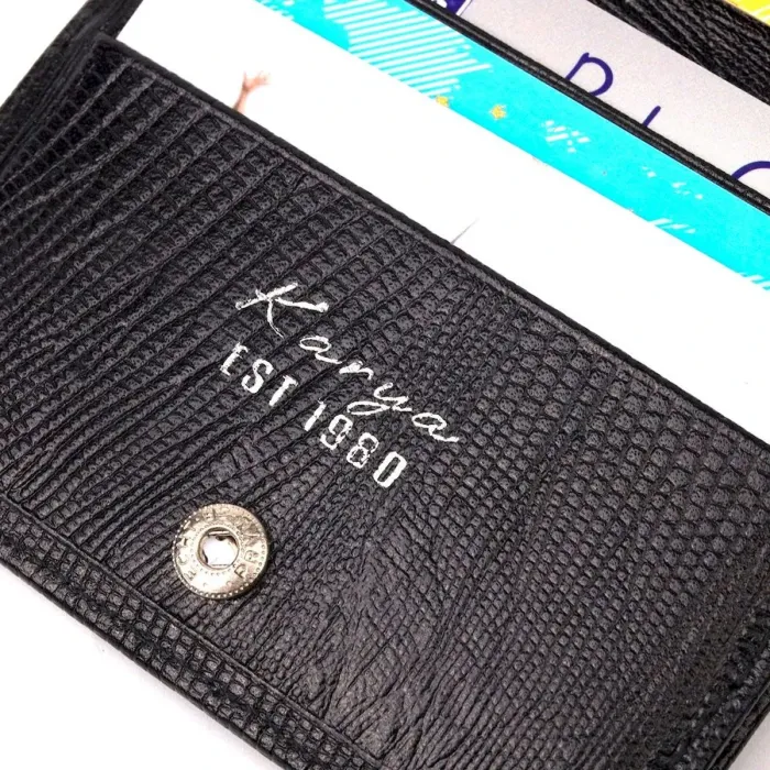 Красивий чоловічий гаманець із фактурної шкіри під рептилію KARYA 21059 Чорний