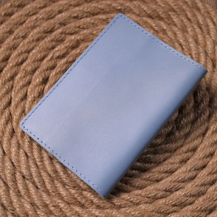 Оригінальна шкіряна обкладинка на паспорт комбі двох кольорів Серце GRANDE PELLE 16729 Жовто-блакитна