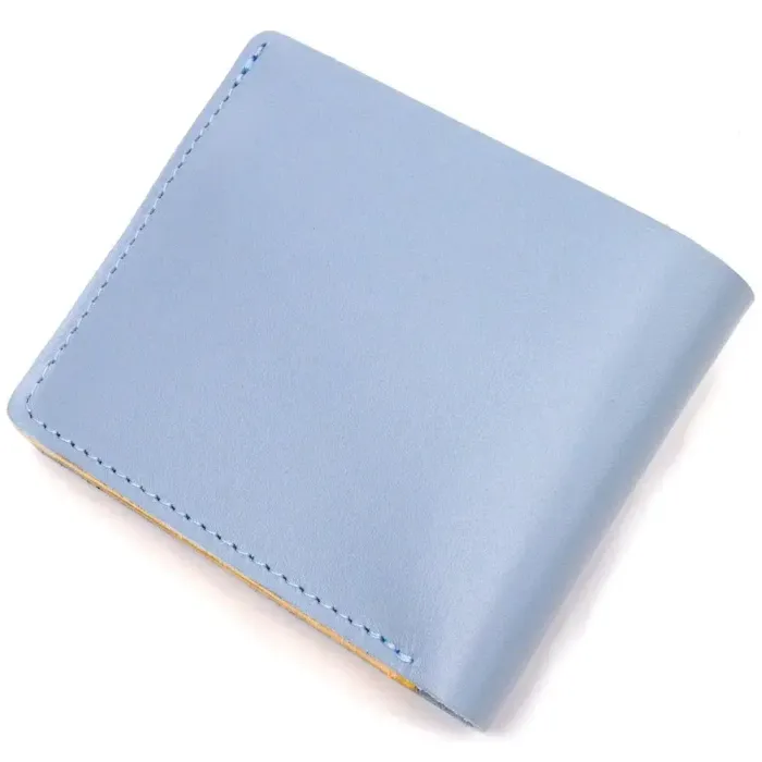 Оригінальне шкіряне портмоне у два додавання комбі двох кольорів Серце GRANDE PELLE 16732 Жовто-блакитне