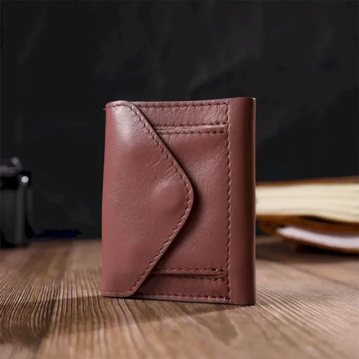 Вертикальне невелике жіноче портмоне в три додавання GRANDE PELLE 16784 Пудровий