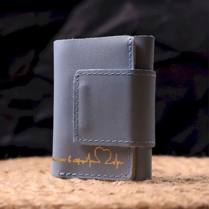 Жіноче шкіряне портмоне в три додавання комбі двох кольорів Серце GRANDE PELLE 16731 Жовто-блакитне